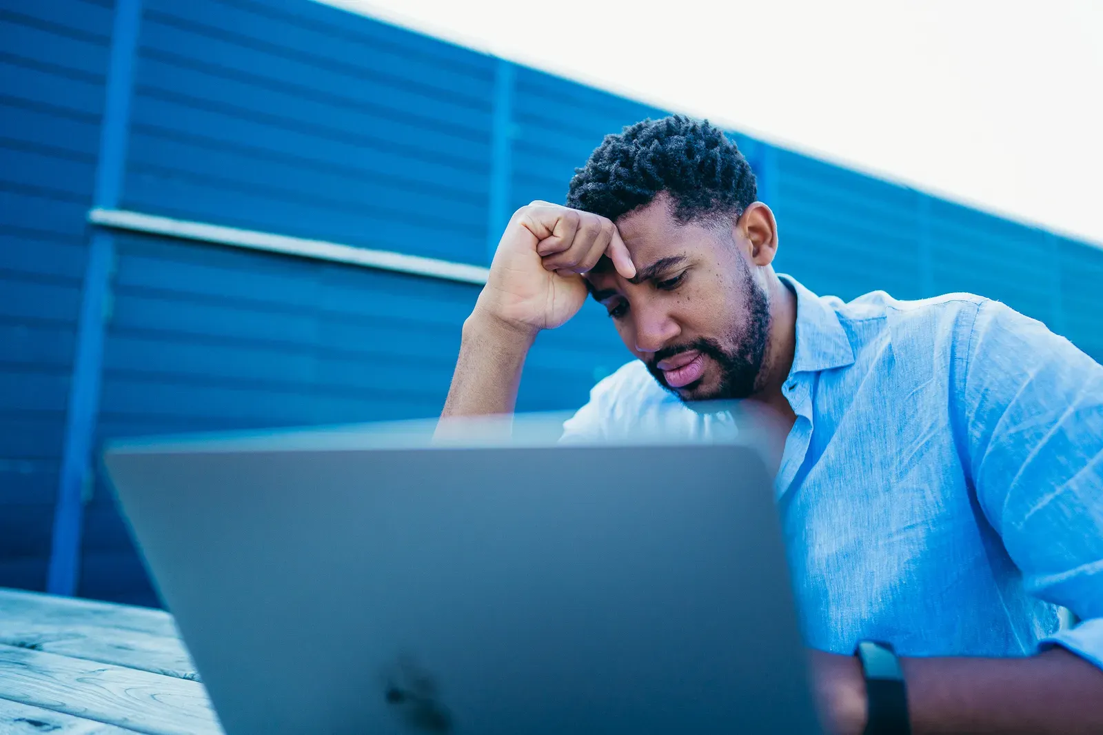 Self-employed finance professional working on a freelance assignment with a laptop